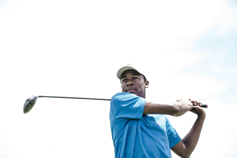 a man in a blue shirt swinging a golf club, jemal shabazz, avatar image