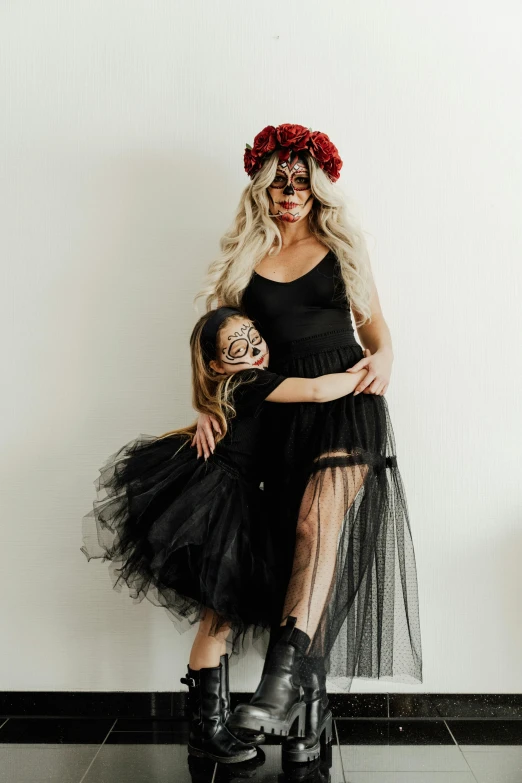 a woman in a black dress and a little girl in a black dress, sugar skull, pose 4 of 1 6, tulle and lace, maternal