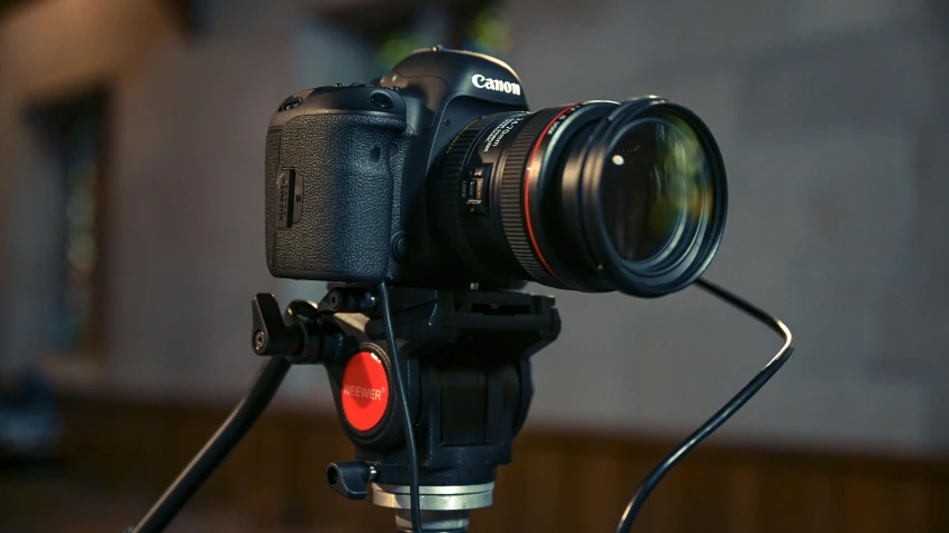 a close up of a camera on a tripod, by Matthias Stom, unsplash, video art, product lighting. 4 k, canon eos 6d, hd footage