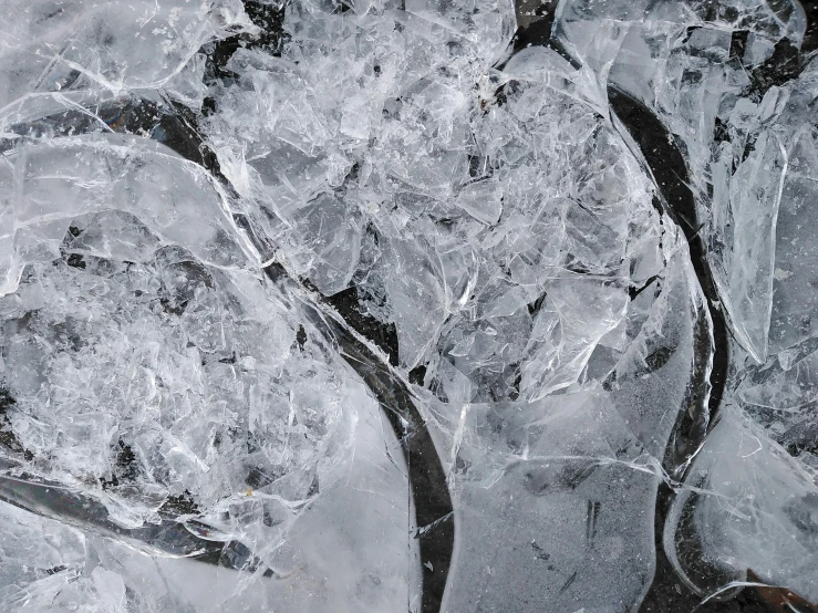 a pair of tennis racquets covered in ice, inspired by Vija Celmins, trending on pexels, abstract expressionism, black, ice cave, whirlpool, grey