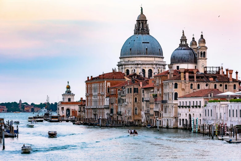 a large body of water filled with lots of buildings, by Canaletto, pexels contest winner, baroque, domes, profile image, early evening, viridian and venetian red