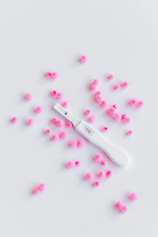a close up of a toothbrush on a white surface, scattered glowing pink fireflies, pregnant, het meisje met de parel, high resolution print :1 cmyk :1