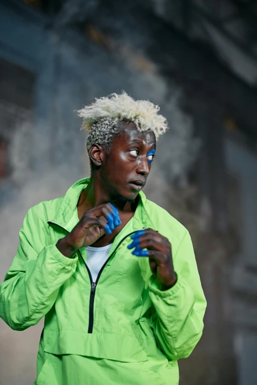 a woman in a green jacket holding a tennis racquet, by artist, trending on unsplash, afrofuturism, 3 actors on stage, blue-white hair, somalia, ( ( theatrical ) )