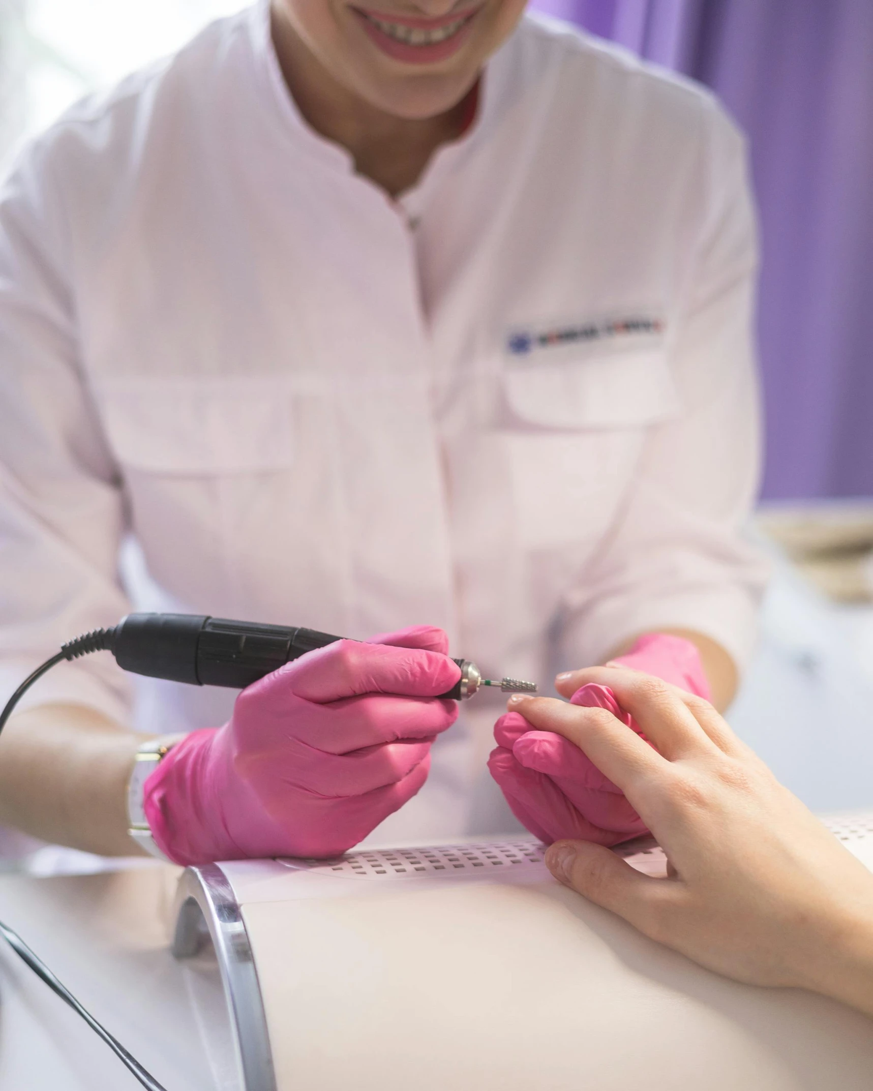 a woman getting her nails done at a nail salon, happening, trans rights, in a lab, discovered for the first time, so cute