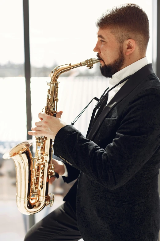 a man in a suit playing a saxophone, profile image, large)}], on the coast, on a pale background