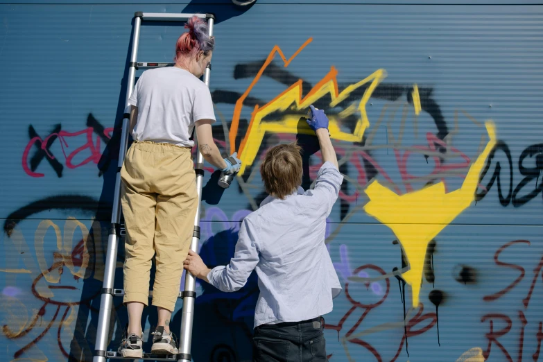 a couple of men standing on top of a ladder, pexels, graffiti, avatar image, tending on art station, non-binary, swedish