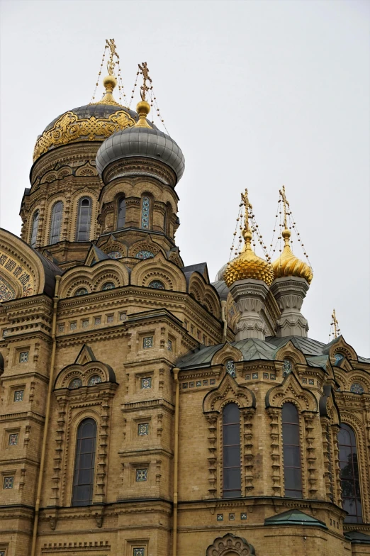 a large building with a golden dome on top of it, inspired by Konstantin Savitsky, flickr, 2 5 6 x 2 5 6 pixels, spires, grey skies, orthodox icons