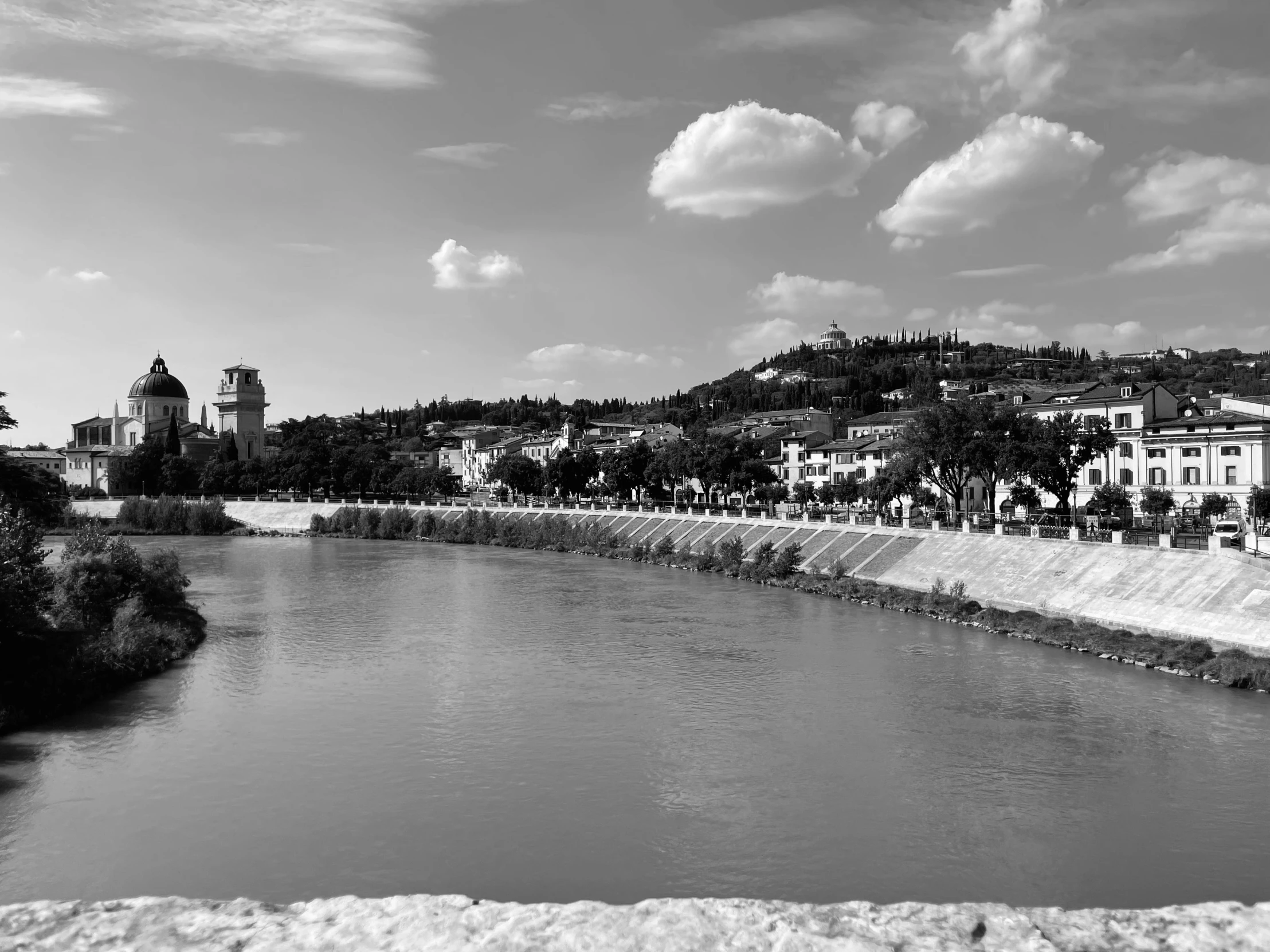 a black and white photo of a river, a black and white photo, by Mirko Rački, renaissance, in the foreground a small town, sunny summer day, river of wine, photographic print