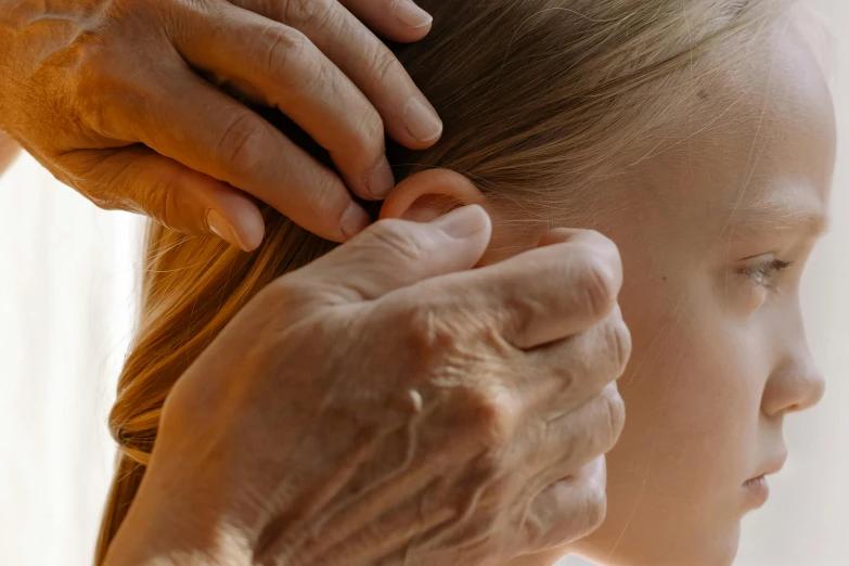 an older woman combing a young girl's hair, by Lee Loughridge, trending on pexels, renaissance, chiroptera ears, side view close up of a gaunt, acupuncture treatment, softly shadowed