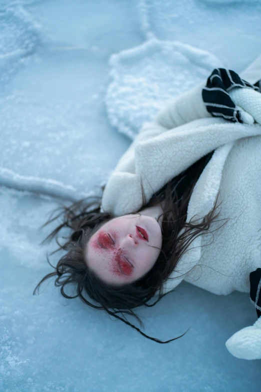 a woman laying on top of a snow covered ground, inspired by Gottfried Helnwein, pexels contest winner, renaissance, with a hurt expression, arctic, pale white face, inuit