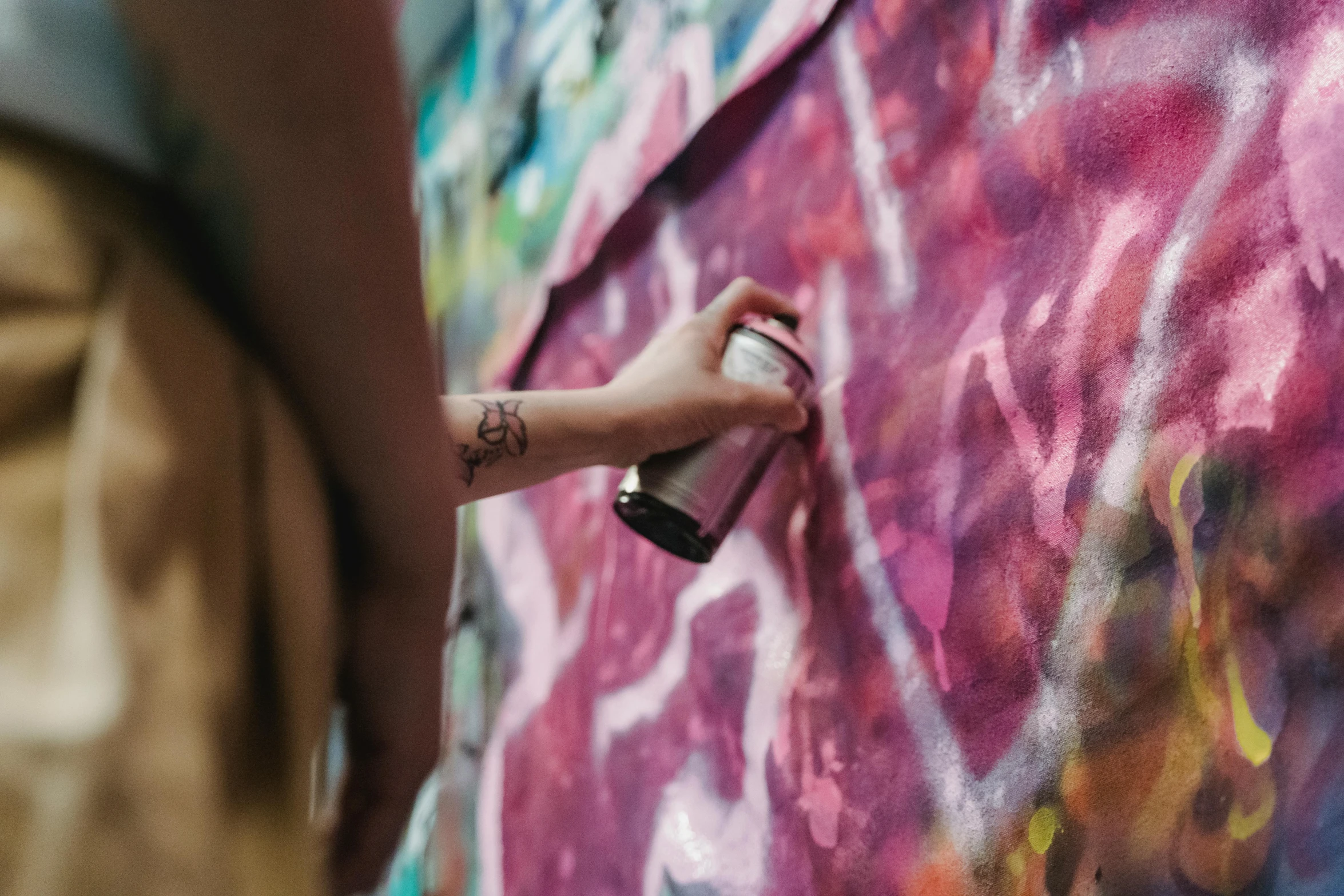 a person spraying graffiti on a wall with a spray can, pexels contest winner, graffiti, watercolors on canvas, female emo art student, metallic paint, medium [ graffiti ]