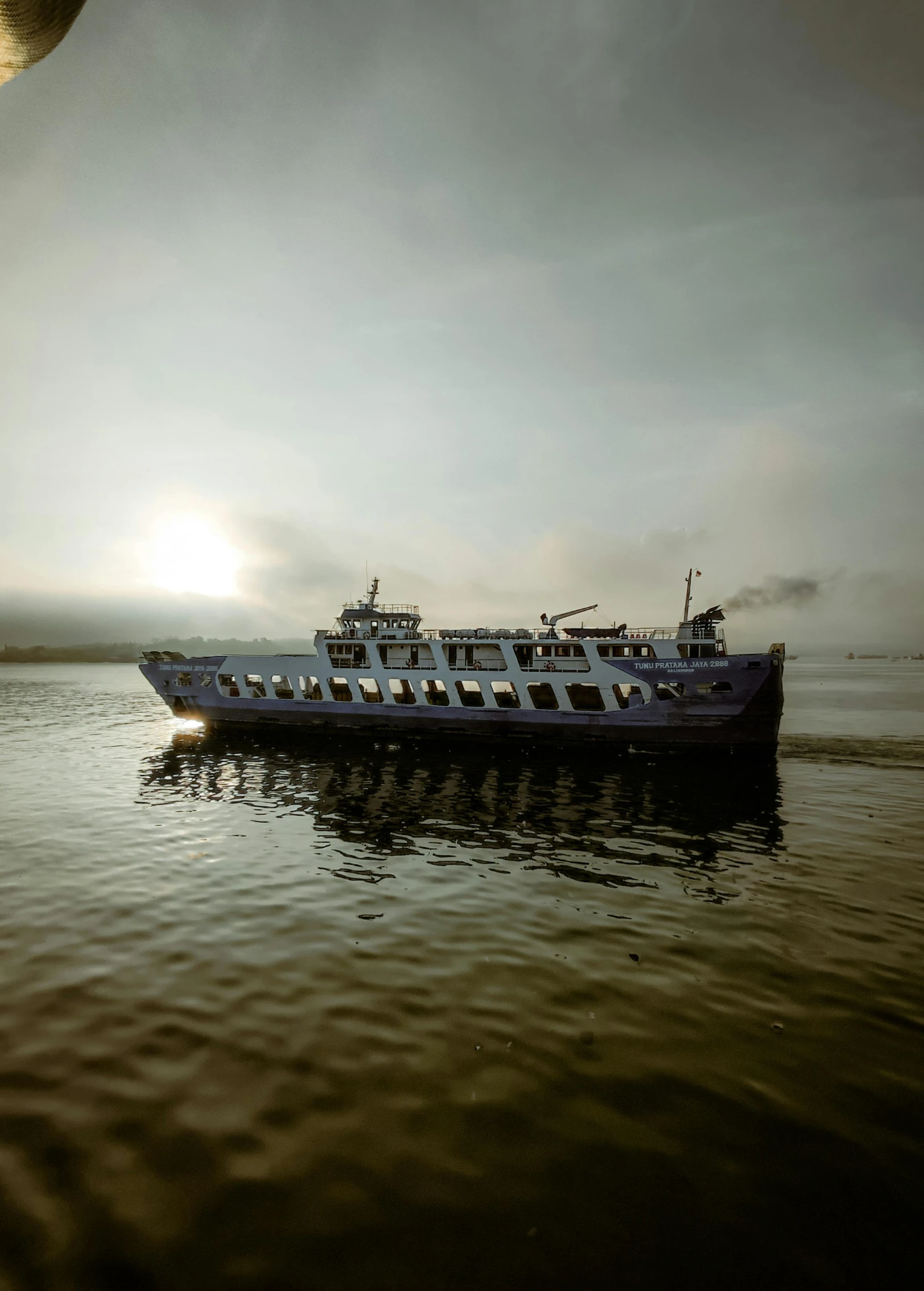 a large boat floating on top of a body of water, by Jan Tengnagel, happening, cinematic morning light, slide show, 2022 photograph, full frame image