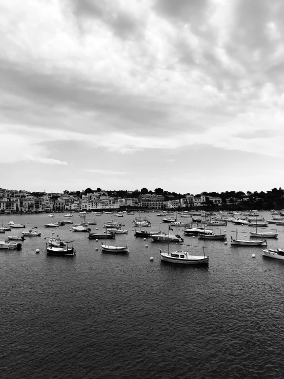 a harbor filled with lots of boats under a cloudy sky, a black and white photo, by Bernard D’Andrea, 256x256, caroline gariba, today\'s featured photograph 4k, by joseph binder
