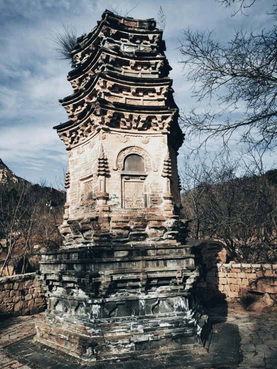 a very tall tower sitting on the side of a hill, inspired by Qian Gu, unsplash contest winner, baroque, mausoleum tall ruins, winter, ancient”