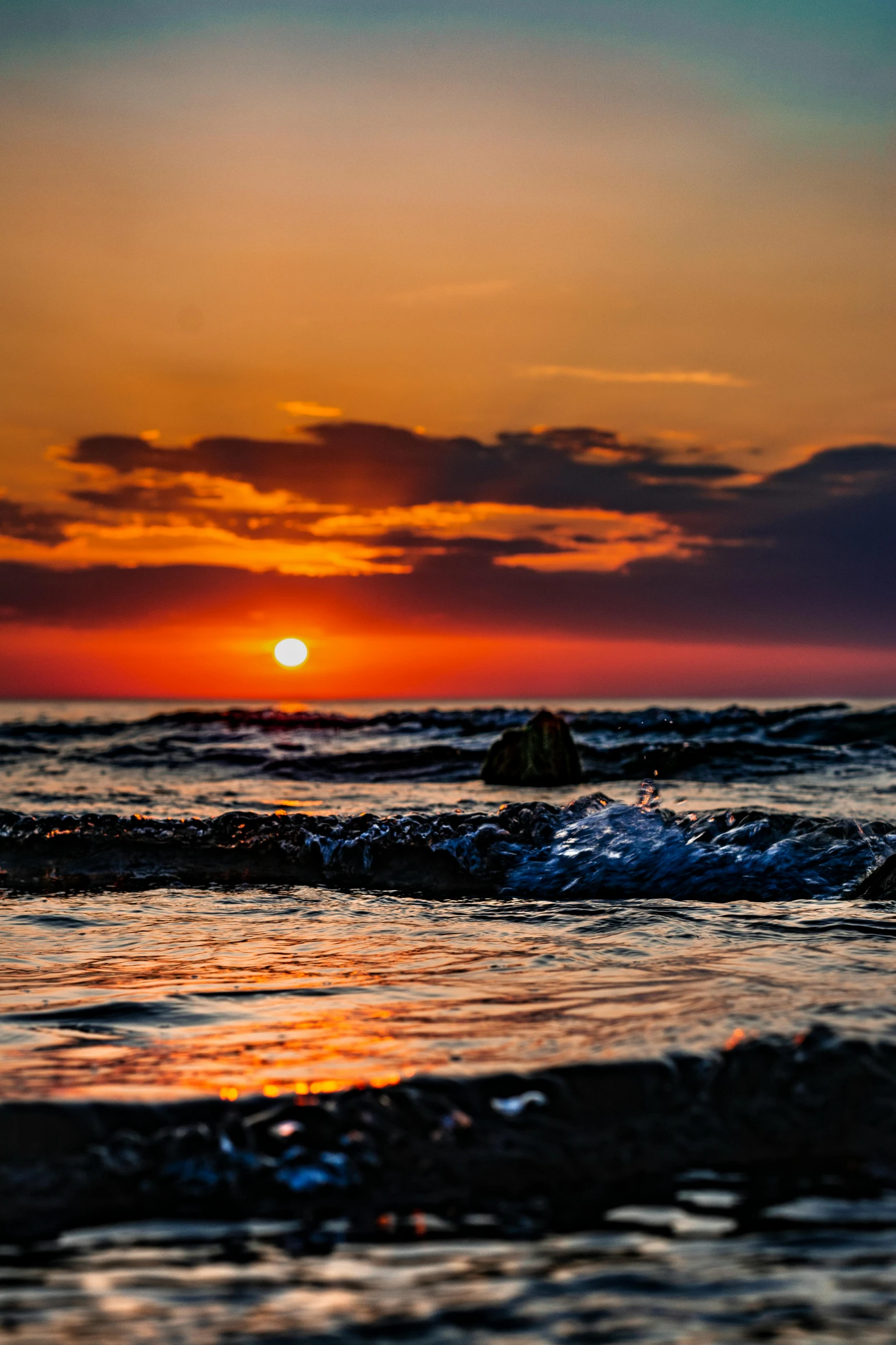 a man riding a wave on top of a surfboard, a picture, pexels contest winner, romanticism, orange sun set, black sea, red sun over paradise, slide show