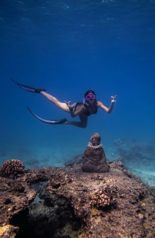 a person that is swimming in the water, a statue, great barrier reef, doing a sassy pose, female ascending, long flowing fins