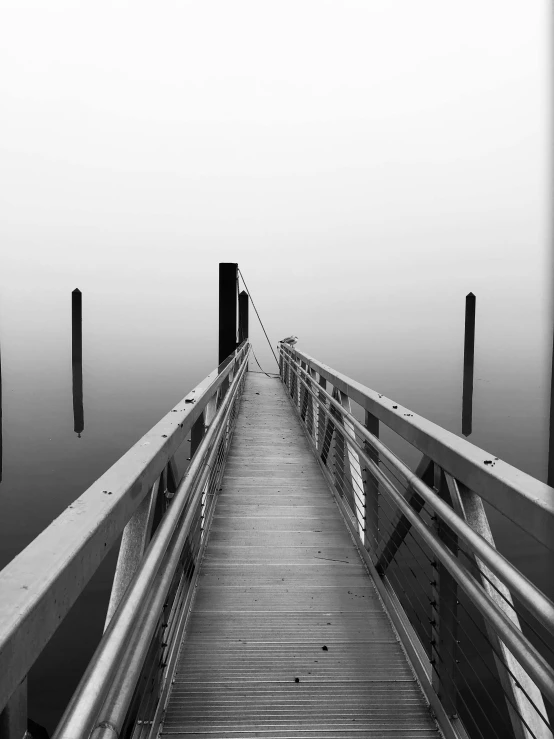 a black and white photo of a dock, postminimalism, fog. by greg rutkowski, 2 5 6 x 2 5 6 pixels, photo on iphone, pov photo