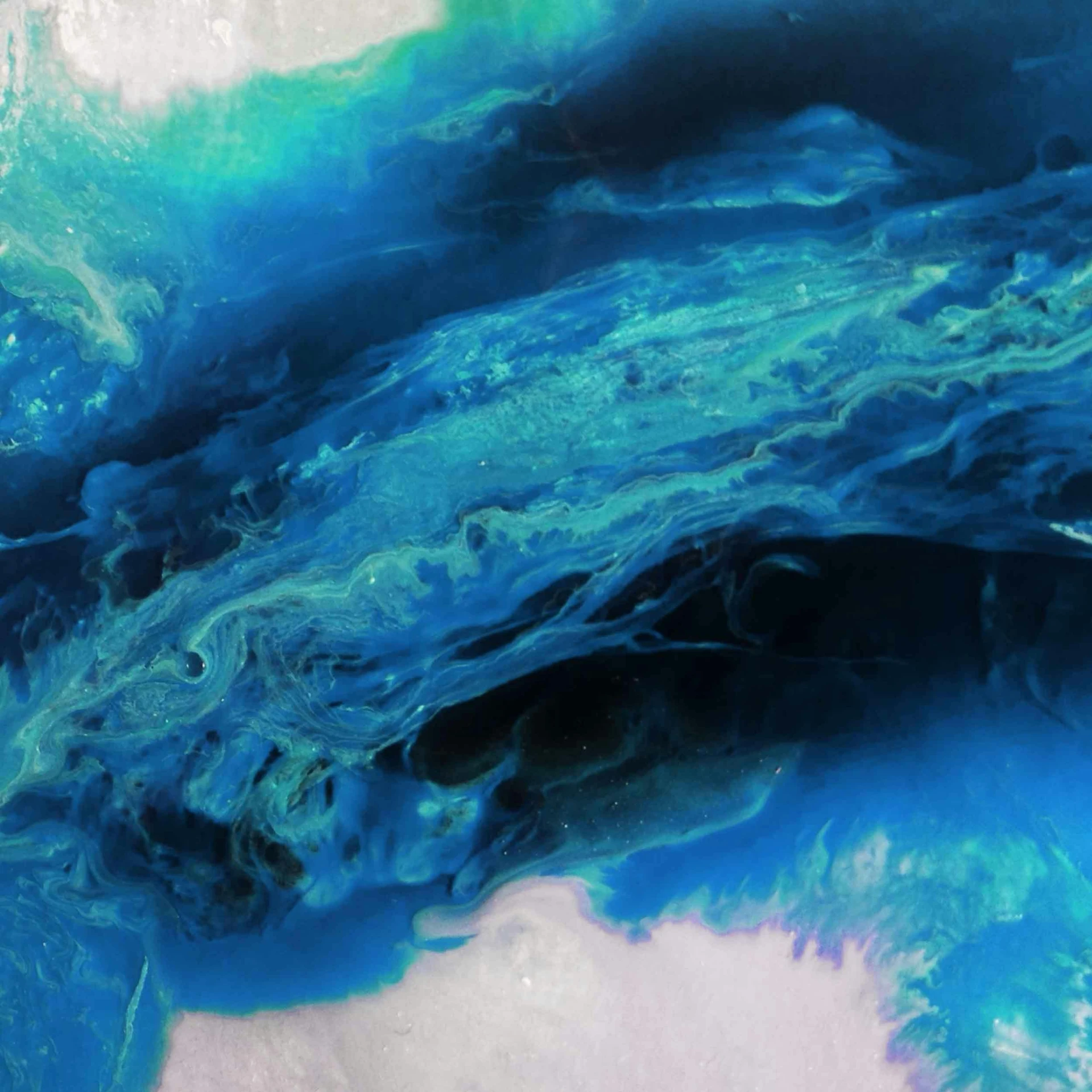 a close up of a blue and green substance, an abstract painting, flickr, generative art, blue whale, seen from space, flowing material, similar to the bifrost