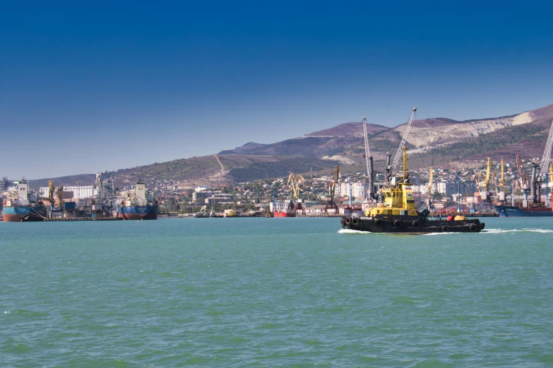 a tug boat in the middle of a large body of water, by Arthur Sarkissian, pexels contest winner, harbour in background, panorama, high quality product image”, rostov