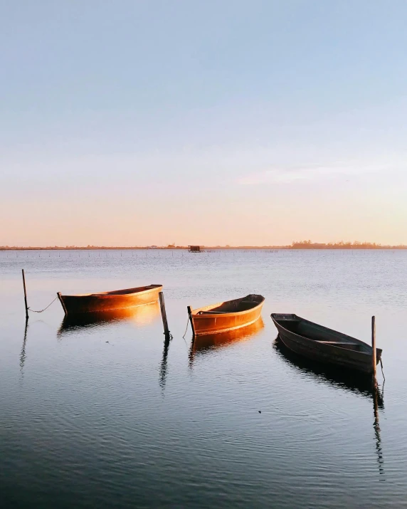 a group of boats floating on top of a lake, the three moiras, cute photo, olivia de bernardinis, lgbtq