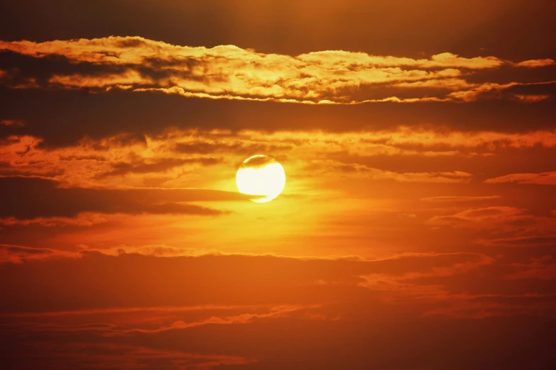 the sun is setting behind the clouds in the sky, inspired by Sun Long, pexels, romanticism, digital yellow red sun, heat waves, instagram post, ((sunset))