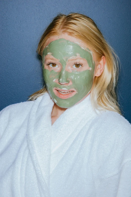 a woman with a green mask on her face, reddit, happening, goop, sydney sweeney, spa, taken in the mid 2000s