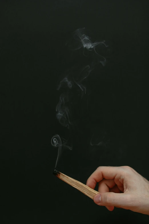 a person holding a matchstick with smoke coming out of it, by Pablo Rey, chalkboard, 15081959 21121991 01012000 4k, hand, sage smoke