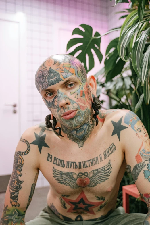 a man with a lot of tattoos on his body, inspired by Seb McKinnon, trending on pexels, hyperrealism, terry richardson, shaven face, okuda, taken in the early 2020s
