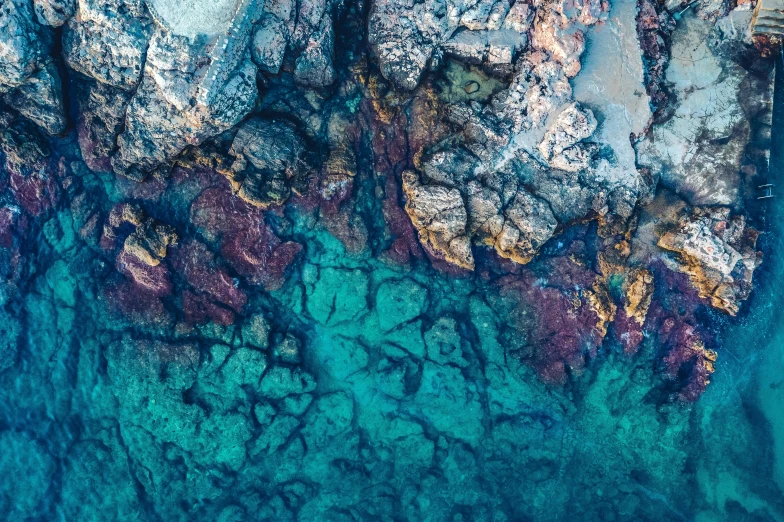 a bird's eye view of some rocks and water, by Matt Cavotta, unsplash contest winner, glass antikythera, underwater soft colours, detailed textures, bird\'s eye view