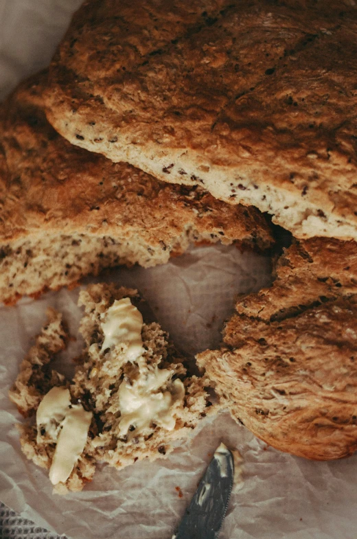 a loaf of bread with a bite taken out of it, pexels, art nouveau, rustic, big oatmeal, high angle close up shot, irish