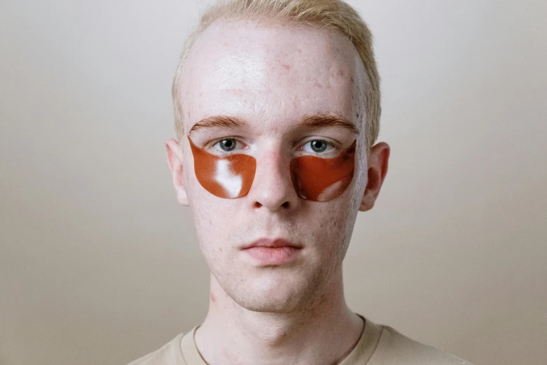 a man with a pair of eye patches on his face, an album cover, by Ellen Gallagher, reddit, hyperrealism, cinnamon skin color, high quality photo, bandages, silicone skin