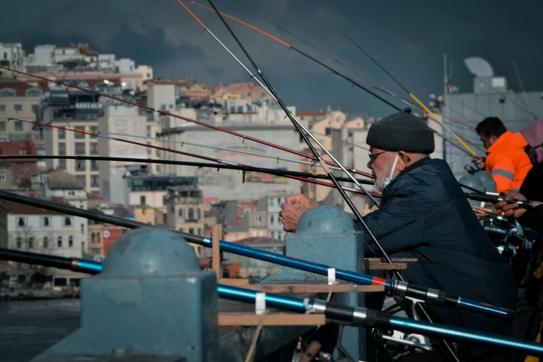 a group of men standing next to each other on top of a pier, by Carlo Martini, pexels contest winner, renaissance, fishing, istanbul, an oldman, profile image