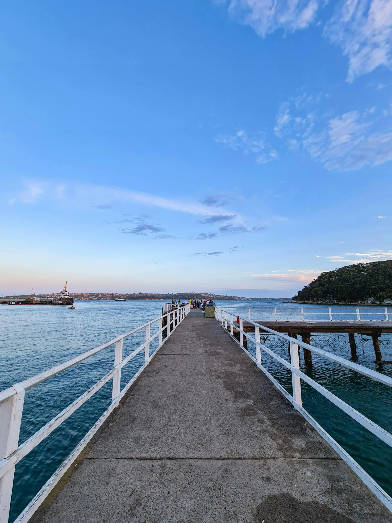 a pier in the middle of a body of water, happening, manly, profile image