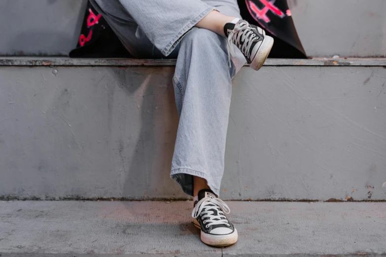 a person sitting on a ledge with a skateboard, trending on pexels, grey pants and black dress shoes, wearing a baggy pajamas, young asian woman, detailed image