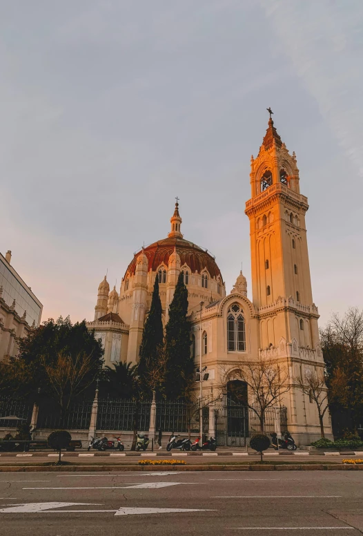 a large white building with a clock tower, inspired by Serafino De Tivoli, pexels contest winner, art nouveau, warm sundown, church cathedral, madrid, art nouveau”