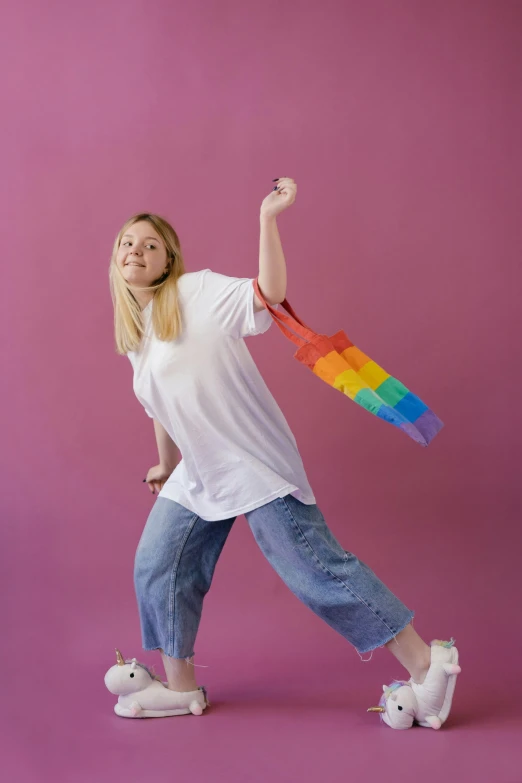 a woman in white shirt and jeans holding an umbrella, pexels contest winner, happening, pride flag in background, fluid bag, sydney sweeney, made out of legos