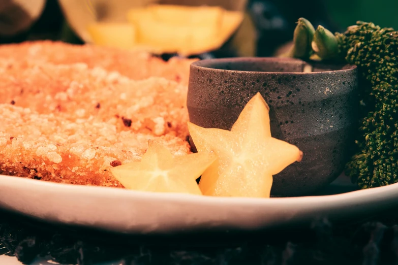 a close up of a plate of food with broccoli, unsplash, renaissance, neon yellow stars, desserts, woodfired, condorito