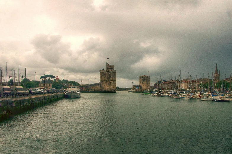 a harbor filled with lots of boats under a cloudy sky, a colorized photo, inspired by Canaletto, pexels contest winner, renaissance, castle towers, grain”, portrait”, grey