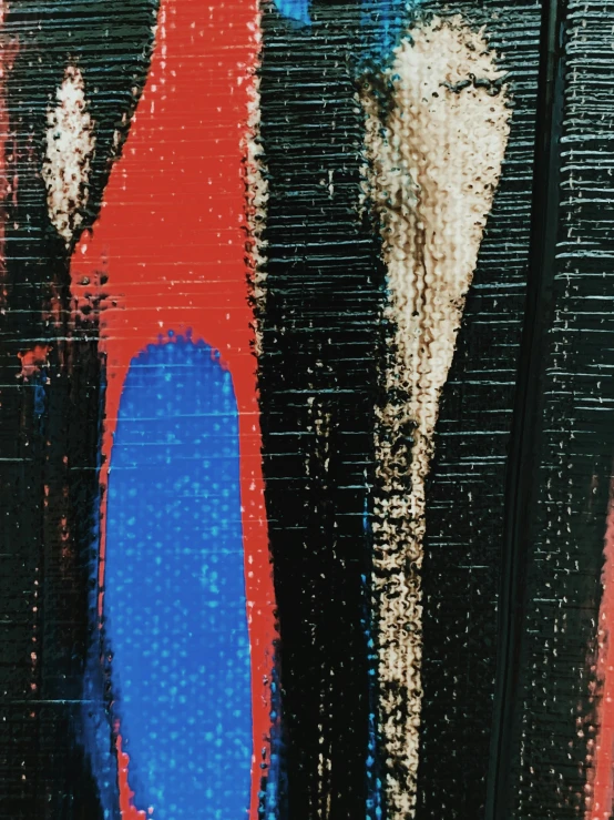 a close up of a painting on a wall, inspired by Hans Hartung, red and blue garments, ((woodblock)), 8k vhs glitch, daido moriyama