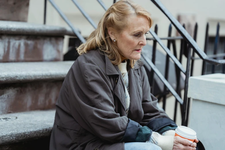 a woman sitting on the steps with a cup of coffee, by Helen Stevenson, trending on reddit, skilled homeless, gillian anderson, 15081959 21121991 01012000 4k, manhattan