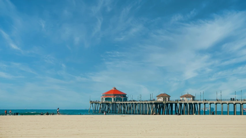 a pier sitting on top of a sandy beach, by Jacob Burck, unsplash contest winner, renaissance, clear blue skies, square, los angelos, banner