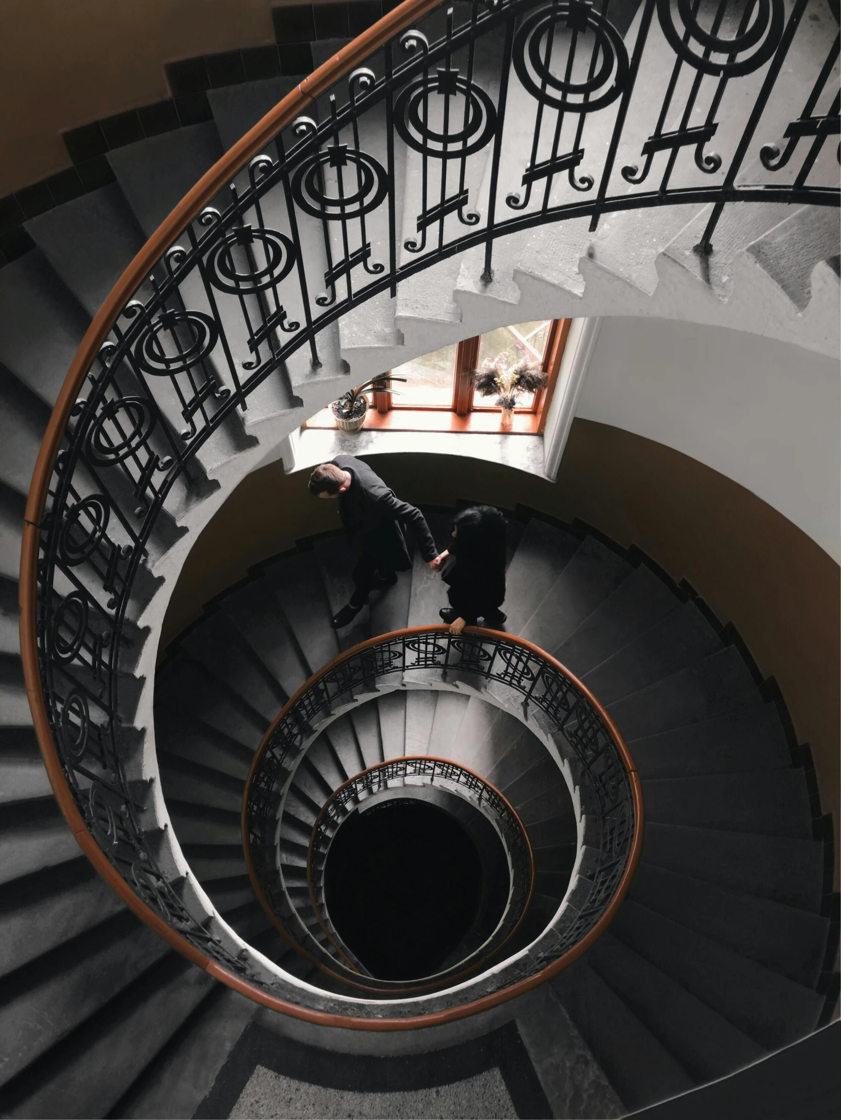 a man standing at the top of a spiral staircase, dark academia, working hard, instagram story, museum quality photo