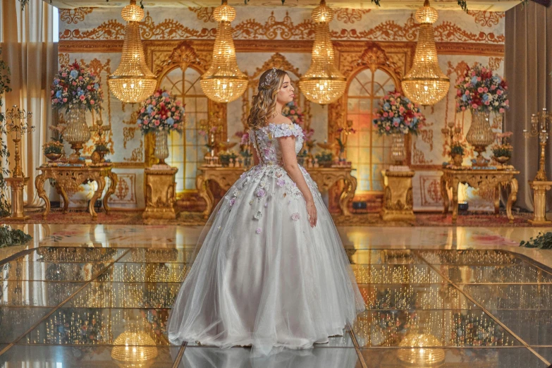 a woman in a wedding dress standing in front of a chandelier, by Rhea Carmi, pexels contest winner, rococo, lady with glowing flowers dress, 1 6 years old, greek ameera al taweel, beautiful background