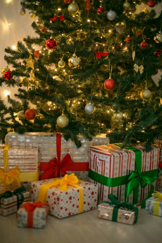 a christmas tree with presents in front of it, by Dan Content, shutterstock, full frame image, #trending, screensaver, instagram post