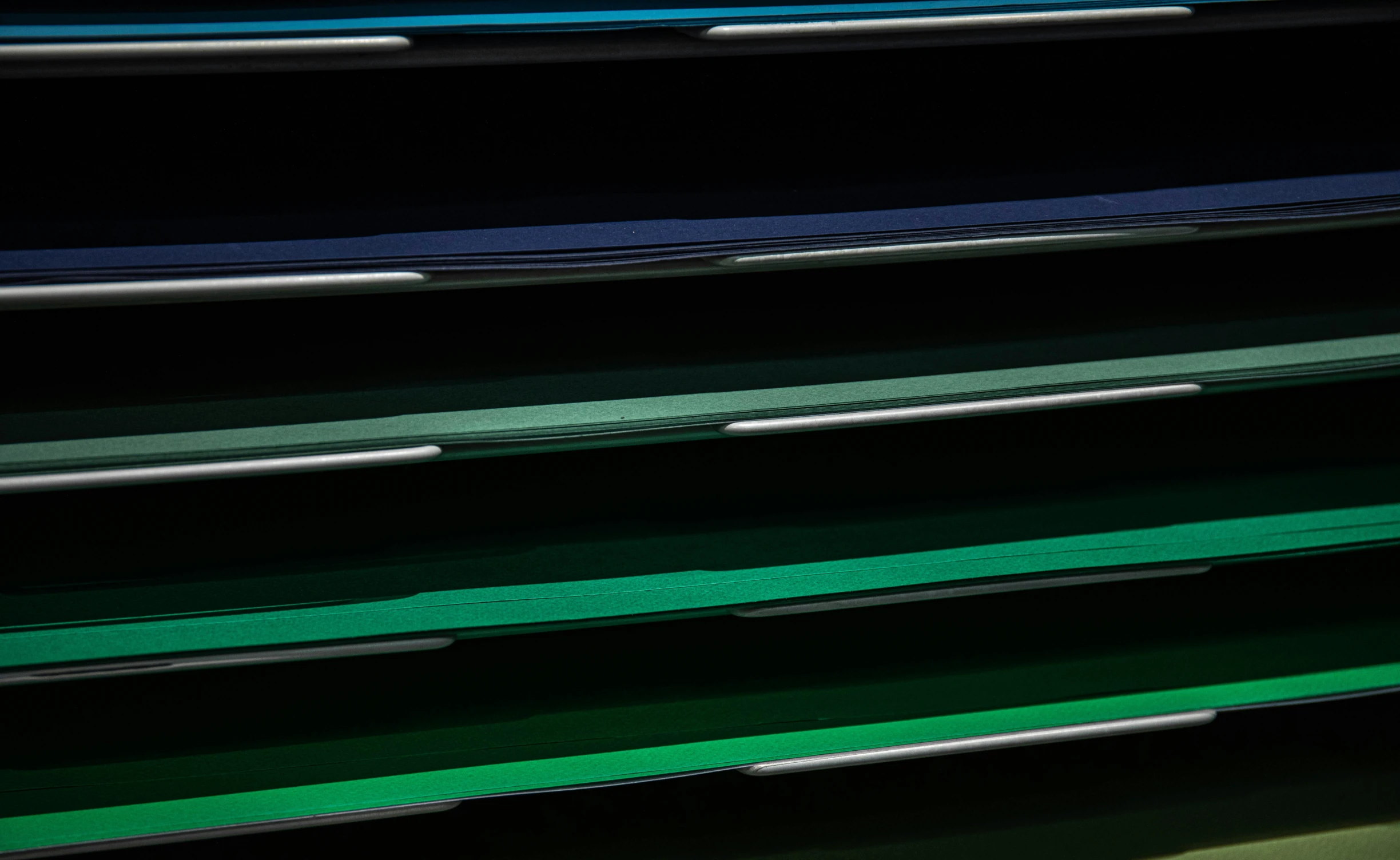 a bunch of folders stacked on top of each other, inspired by Pierre Soulages, color field, dark blue and green tones, multi - coloured, color ( sony a 7 r iv, detailed product image