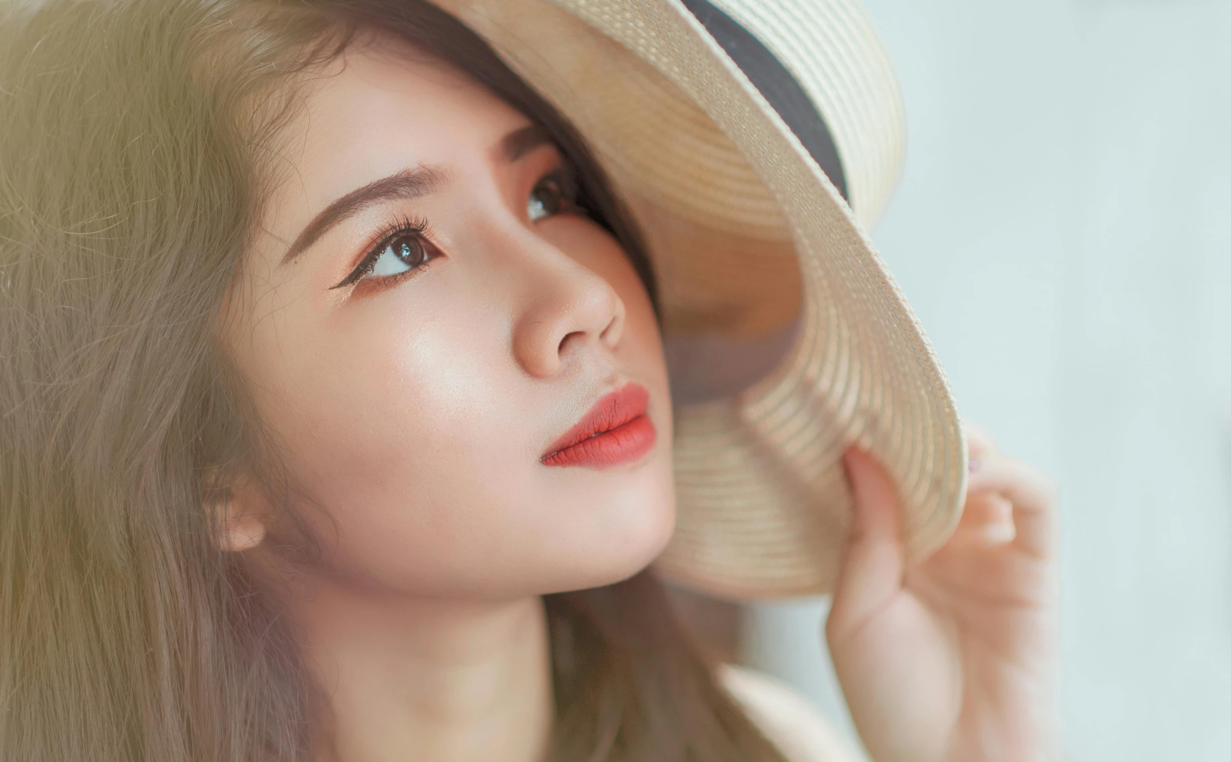 a close up of a person wearing a hat, inspired by Tan Ting-pho, trending on pexels, realism, anime thai girl, skincare, attractive photo, porcelain skin ”