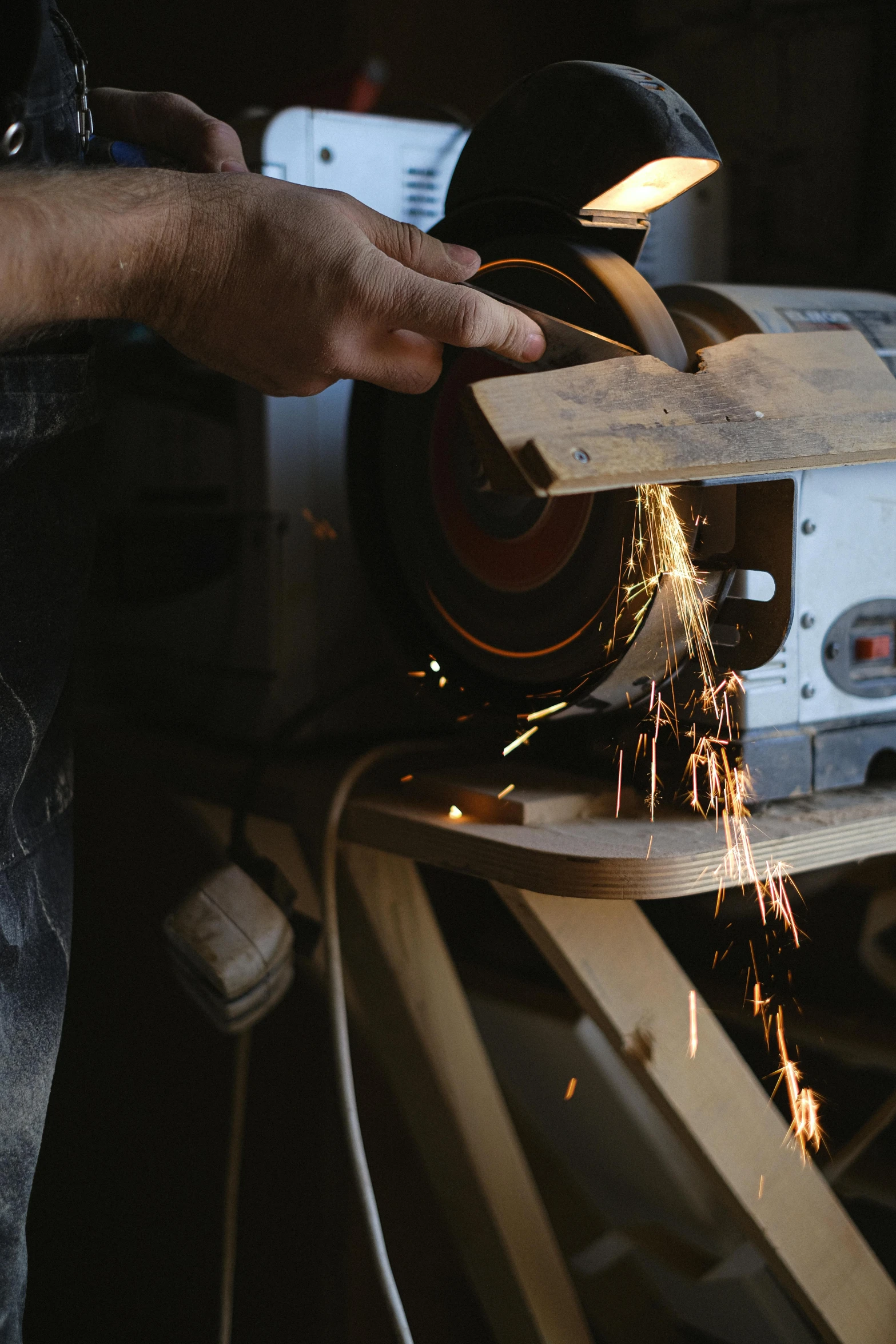 a man grinding a piece of wood with a grinder, pexels contest winner, arbeitsrat für kunst, steel plating, album cover, avatar image, thumbnail