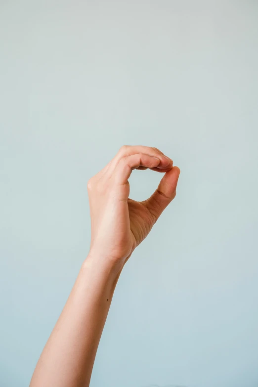 a person holding a doughnut in their hand, unsplash, minimalism, holding a pudica pose, epicanthal fold, plain stretching into distance, very thin