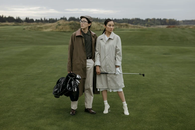 two people standing next to each other on a golf course, a portrait, by Winona Nelson, unsplash, renaissance, trench coat, bo chen, in style of norman rockwell, hermes