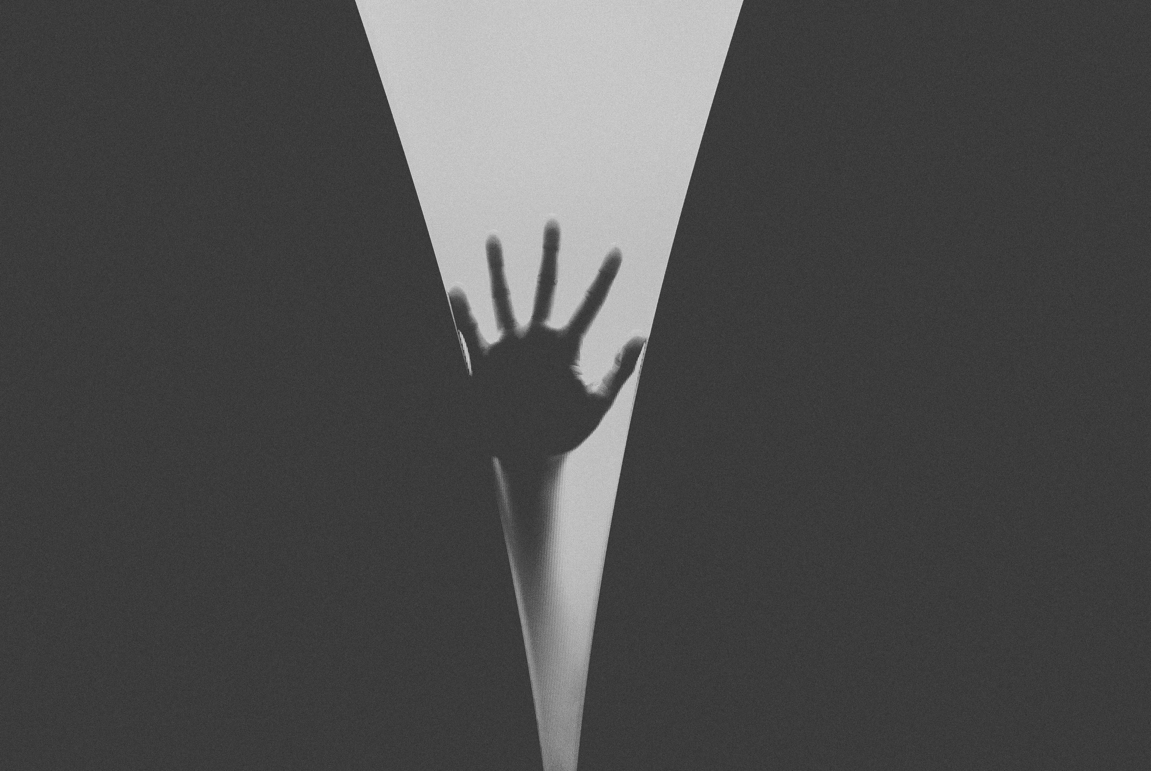 a black and white photo of a person's hand, by Karl Buesgen, unsplash, conceptual art, keyhole, horror wallpaper aesthetic, hand on hips, ffffound